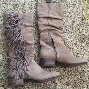 Knee high fringed boots